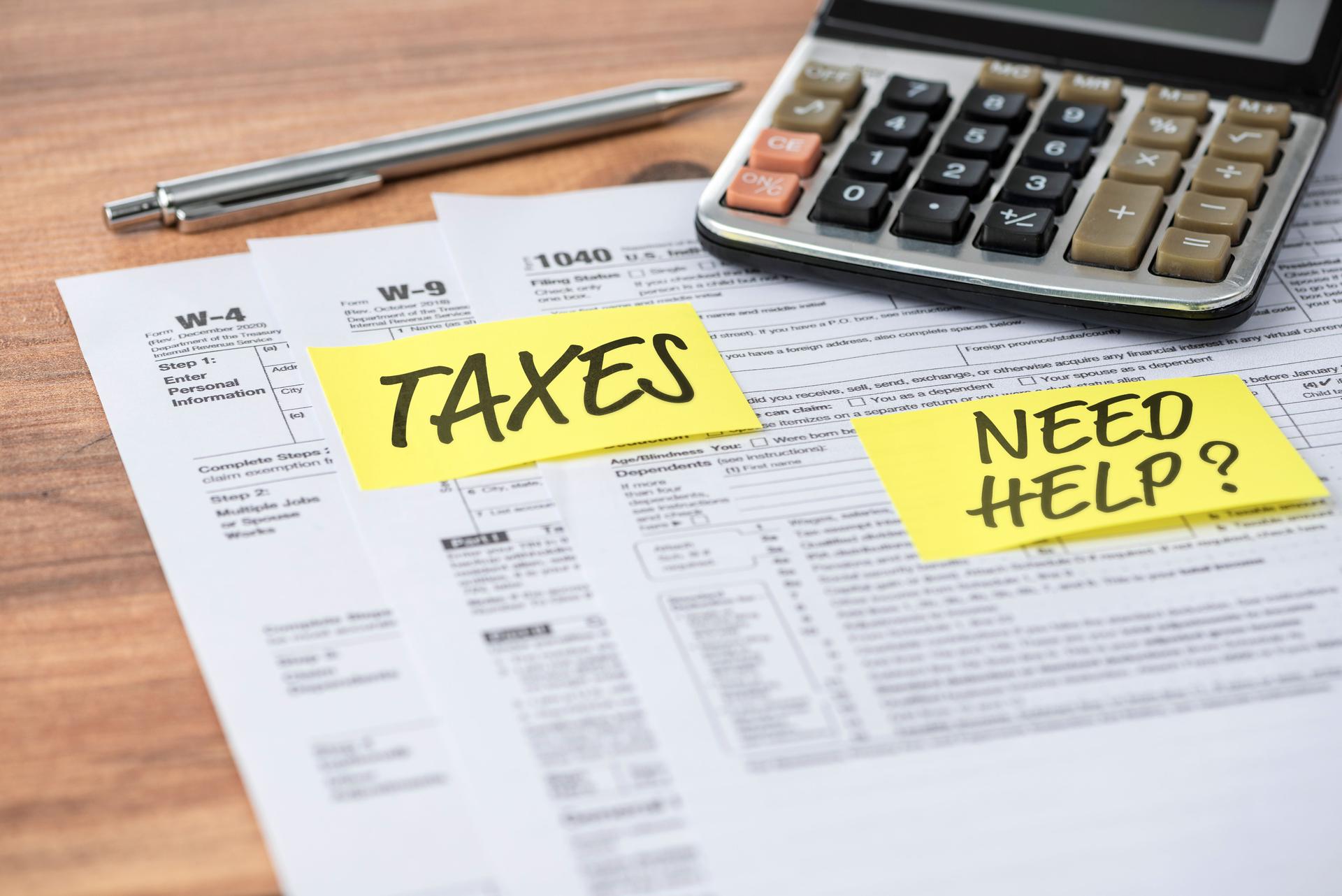 TAXES and NEED HELP note on tax forms. Tax concept